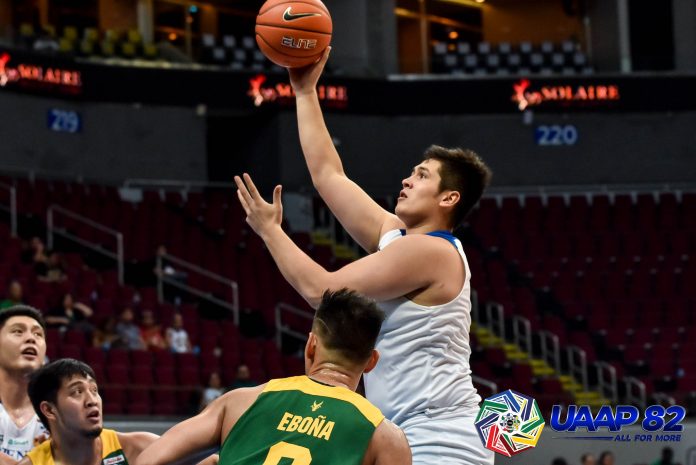 Ateneo de Manila University Blue Eagles’ Pat Maagdenberg scores a hook shot after losing his defender Barkley Ebona of Far Eastern University Tamaraws. UAAP PHOTO