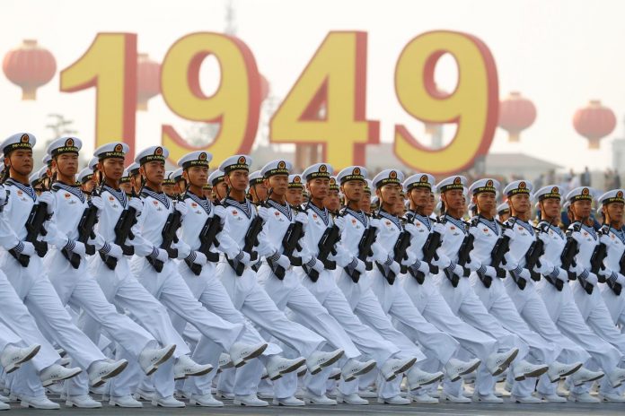 Soldiers of the People’s Liberation Army march past Tiananmen Square during a rehearsal before a military parade marking the 70th founding anniversary of People’s Republic of China in Beijing on Oct. 1. REUTERS/THOMAS PETER