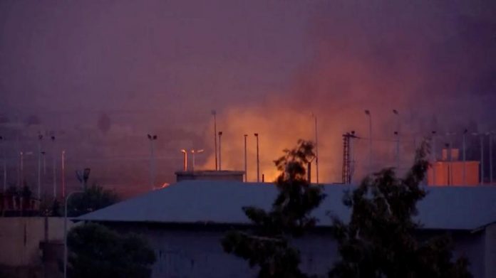 Fire burns and smoke billows out in border town Tel Abyad, Syria on Oct. 10. REUTERS/REUTERSTV