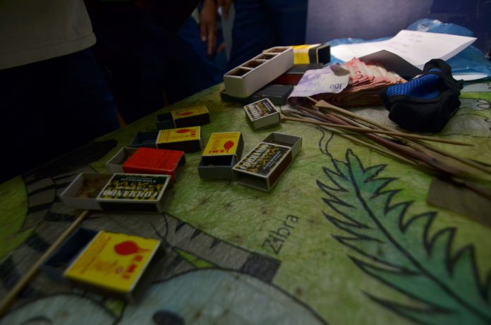 Police seized these boxes containing spiders, bet money and sticks from 22 persons engaging in a “spider derby” in Barangay Guzman-Jesena, Mandurriao district. IAN PAUL CORDERO