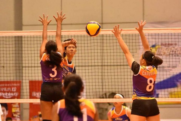 Bacolod Tay Tung’s Alyssa Bertolano scores against two Iligan City National High School defenders. PHOTO COURTESY OF REBISCO VOLLEYBALL LEAGUE