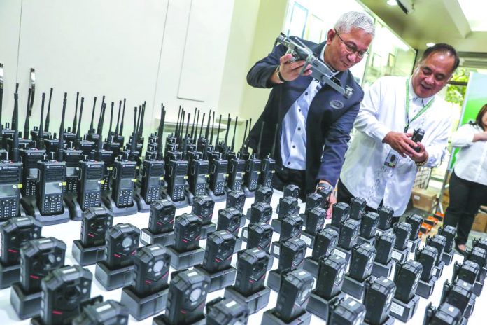 In this 2018 photo, Philippine Drug Enforcement Agency chief Aaron Aquino inspects body cams and other equipment for use in the government’s campaign against illegal drugs. Vice President Leni Robredo says body cams are “indispensable.” ABS-CBN NEWS