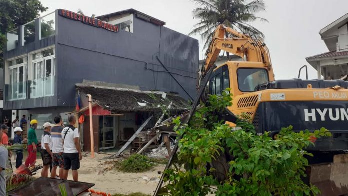 The Inter-Agency Rehabilitation Management Group demolishes non-compliant establishments in Boracay Island, Malay, Aklan early this month. Recently, Judge Ronald Exmundo of the Regional Trial Court Branch 7 inhibited himself from a case over the demolition of several structures in the island. NOEL CABOBOS/RADYOTODO/88.5FM/PN