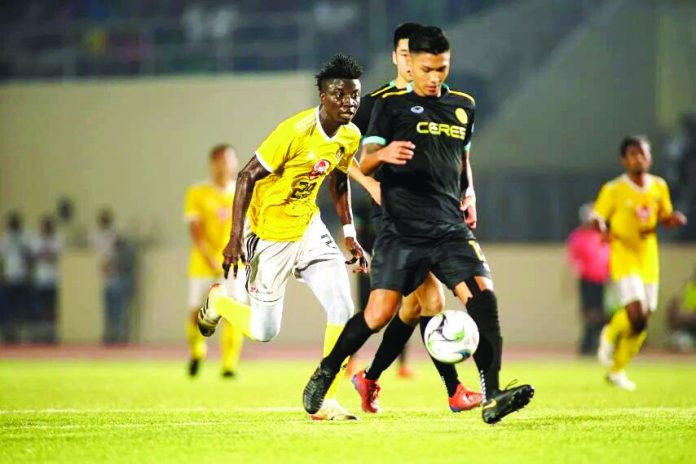 Ceres-Negros FC’s Dennis Villanueva controls the ball as a Kaya Futbol Club-Iloilo defender chases. KAYA-ILOILO PHOTO