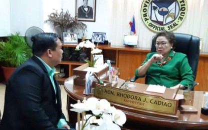 University of Antique president Dr. Pablo Crespo Jr. (left) and Gov. Rhodora Cadiao discuss plans for the university following the release of assistance for the school on Nov. 18. PNA/Annabel Consuelo Petinglay