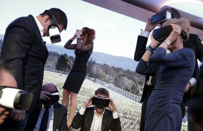 Facebook chief executive officer Mark Zuckerberg and guests use virtual reality headsets during the awards ceremony of the newly established Axel Springer Award in Berlin, Germany. KAY NIETFELD/REUTERS