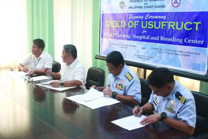 Governor Samuel Gumarin and commander of the Philippine Coast Western Visayas District Commodore Allan Victor Dela Vega sign the Deed of Usufruct on Nov. 11 at the Governor’s Conference Room, PEO Building, San Miguel, Jordan, Guimaras.