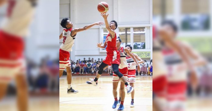 Hua Siong College of Iloilo Red Phoenix’s Julian Maverick Puerto stretches for a layup. PHOTO COURTESY OF WINMEL LEE