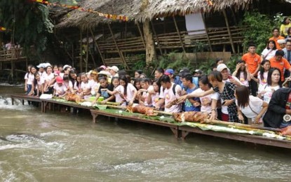 Guests partake of the roasted native pigs as part of the launching of the province’s bid as the Native Lechon Capital of the Philippines in Barangay Tuno, Tibiao, Antique on Oct. 27. ANTIQUE PIO