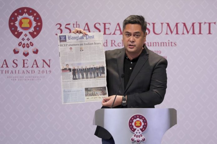 Secretary Martin Andanar presents a real copy of the Bangkok Post newspaper, to show that the story claiming that President Rodrigo Duterte was told to “behave” by King Maha Vajiralongkorn was fake, during a press conference in Nonthaburi, Thailand on Friday night. PCOO GLOBAL MEDIA AFFAIRS