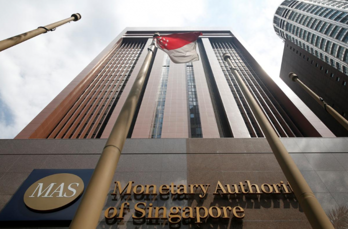 A view of the Monetary Authority of Singapore’s headquarters. Singapore’s central bank plans to bring bitcoin and other similar cryptocurrency futures traded on approved exchanges under its regulation in response to interest from international investors. DARREN WHITESIDE/REUTERS