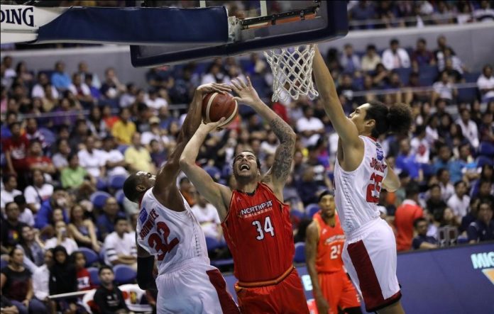 NorthPort Batang Pier’s Christian Standhardinger is foiled by Barangay Ginebra San Miguel Kings’ Justin Brownlee. PBA PHOTO