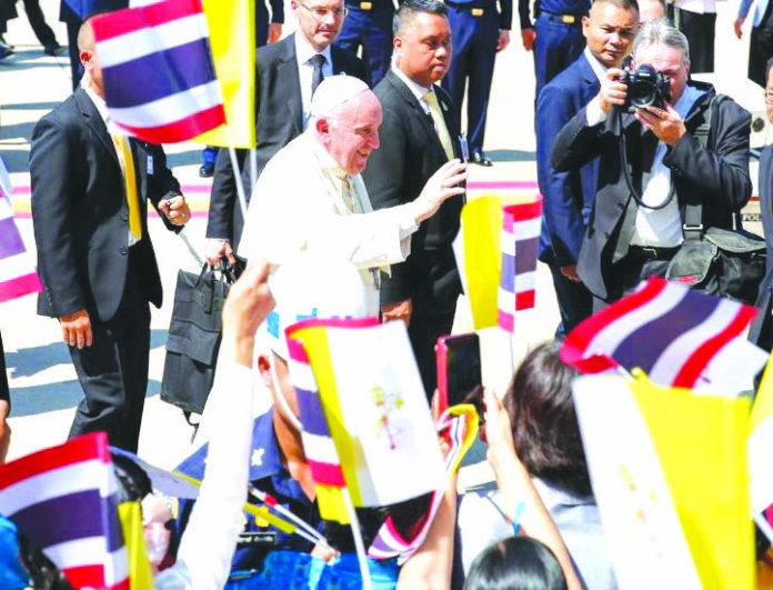 Pope Francis is greeted as he arrives at a military air terminal in Bangkok, Thailand on Nov. 20, 2019. REUTERS