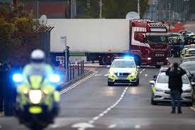 Police move the lorry container where bodies were discovered in Grays, Essex, Britain on Oct. 23. REUTERS/HANNAH MCKAY