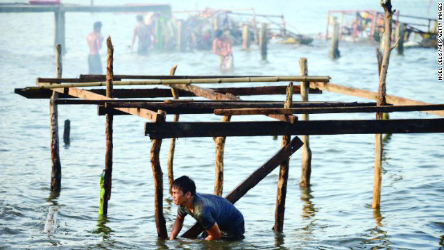 A man reconstructs his home in Tacloban, Leyte after Yolanda, one of the most powerful storms on record, hit the Philippines in November 2013, claiming lives and leaving a total damage of P86.6 billion. GETTY IMAGES