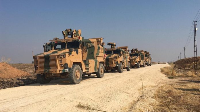 Turkish military vehicles are seen on the Turkish-Syrian border before a joint Turkish-Russian patrol in northeast Syria, near Kiziltepe town in Mardin province, Turkey on Nov. 1. TURKISH DEFENCE MINISTRY/HANDOUT VIA REUTERS