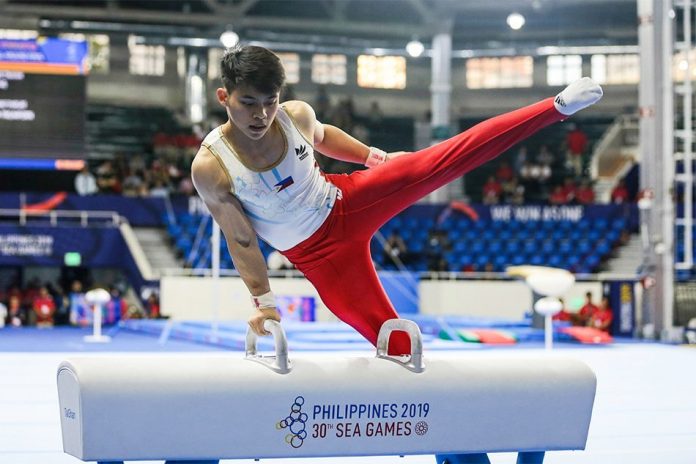 GOLDEN BOY. World champion Carlos Edriel “Caloy” Yulo put on a show in front of his fellow Filipinos en route to a gold medal finish in the individual all-around event in men’s artistic gymnastics yesterday at the Rizal Memorial Coliseum. Yulo, who qualified to the 2020 Tokyo Olympics through the World Championships in Stuttgart in October, served notice of his gold medal intentions with a superb showing in the floor exercise, his pet event. ABS-CBN SPORTS