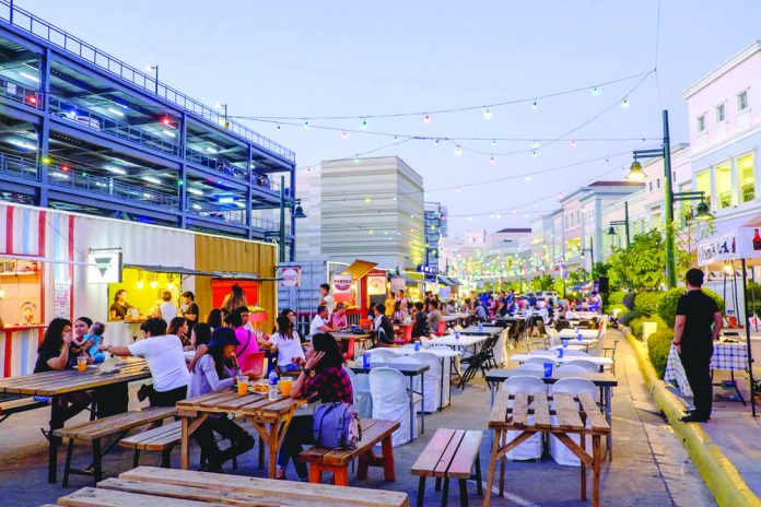 People are seen eating at a food park behind a mall in Iloilo City. The recent Regional Inclusive Innovation Workshop gathered stakeholders across Region 6 to discuss the best methods to improve Iloilo’s industrial and commercial capabilities. MARCO VERCH