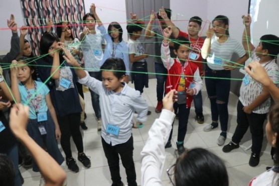 Students of Goshen School of Technology and Humanities Inc. depict an activity called Web of Life during the Dalaw Turo. 