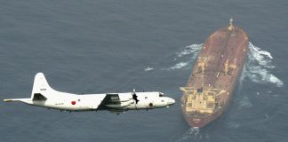 A Japan Maritime Self-Defense Force’s P3-C Orion surveillance aircraft flies over an oil tanker as the plane takes part in an anti-piracy operation at the Gulf of Aden, off Somalia, in this photo taken by Kyodo on Aug. 1, 2015. MANDATORY CREDIT KYODO/VIA REUTERS