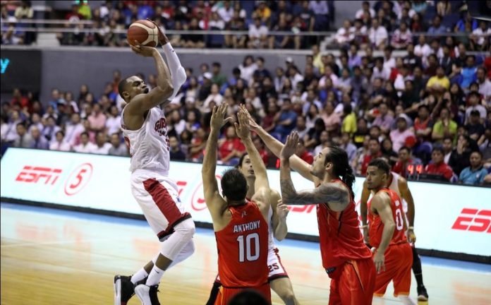 Barangay Ginebra San Miguel Kings’ Justin Brownlee pulls up for a basket against three NorthPort Batang Pier defenders. PBA PHOTO