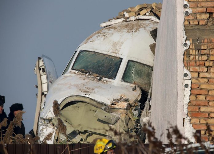 Emergency and security personnel are seen at the site of the plane crash near Almaty, Kazakhstan on Dec. 27. REUTERS/PAVEL MIKHEYEV