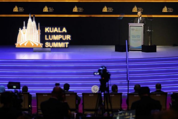 Malaysia’s Prime Minister Mahathir Mohamad delivers his keynote address during a summit in Kuala Lumpur, Malaysia on Dec. 19. REUTERS/LIM HUEY TENG