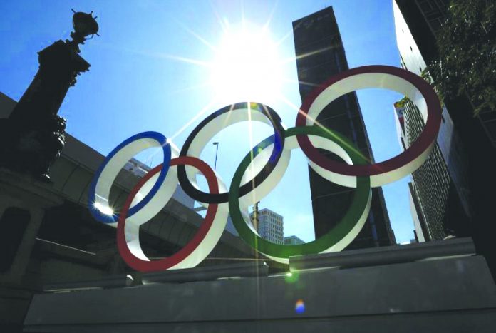 Summer sunshine is seen through Olympic rings displayed at Nihonbashi district in Tokyo, Japan August 5, 2019. REUTERS