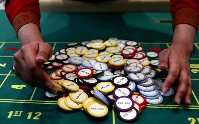 A casino dealer collects chips at a roulette table in Pasay City, Metro Manila, Philippines. Demand for office spaces in the Philippines posted a record-high of 1.7 million square meters this year, driven mainly by higher demand from the gambling industry. REUTERS/ERIK DE CASTRO