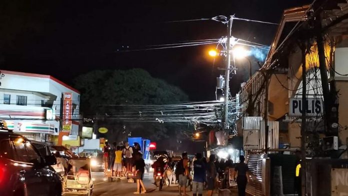 An electrical fire flares up at a post of Panay Electric Co. near the Mandurriao public market on Friday night. Just recently, the Energy Regulatory Commission ordered PECO to correct and explain its violations of the Power Distribution Code.