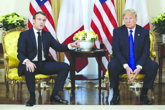 President Donald Trump meets French President Emmanuel Macron at Winfield House, Tuesday, Dec. 3, 2019, in London. AP