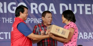 President Rodrigo Duterte distributes relief packs to residents in North Cotabo still reeling from the impact of earthquakes that jolted Mindanao recently. Duterte also led the 123rd Rizal Day rites in Davao City on Monday. PCOO