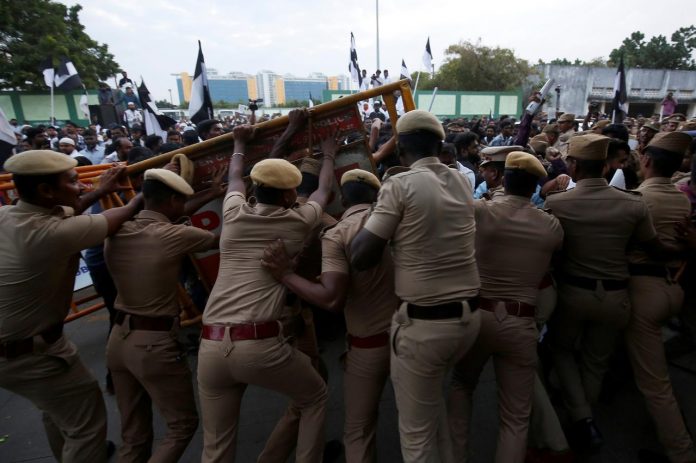 Police stop demonstrators during a protest against a new citizenship law in Chennai, India on Dec. 18. REUTERS/P. RAVIKUMAR