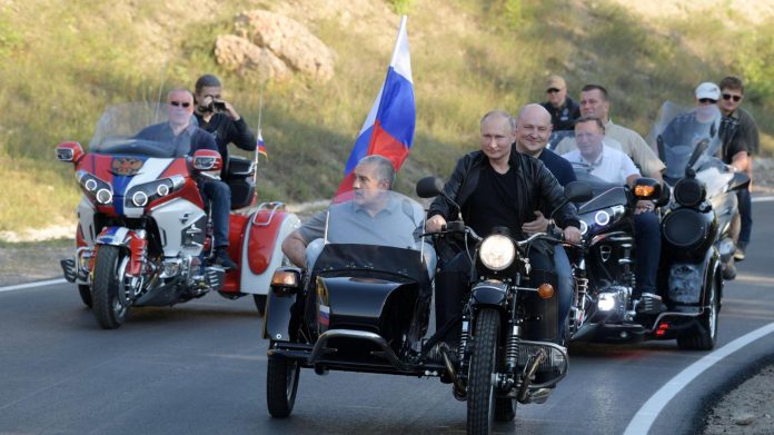 Russian president Vladimir Putin motorcycles through Sevastopol, Crimea. REUTERS