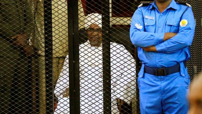 Sudanese former president Omar al-Bashir sits inside a cage during a hearing at a court in Khartoum, Sudan on Dec. 14. REUTERS/MOHAMED NURELDIN ABDALLAH