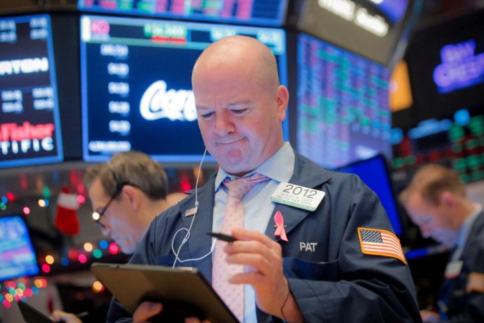 Traders work on the floor at the New York Stock Exchange in New York, United States, Dec. 9, 2019. REUTERS