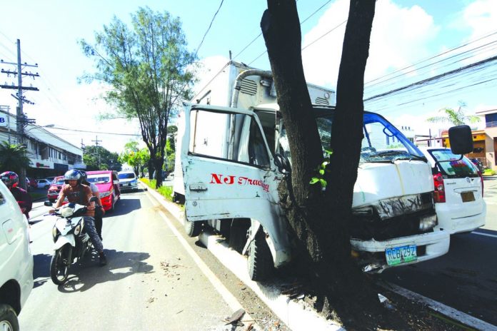 The front of this truck sustained heavy damage after crashing into a tree along General Luna Street, City Proper on Wednesday. IAN PAUL CORDERO/PN