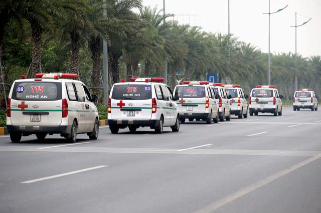 Ambulances believed to be carrying some of the bodies of victims found dead in a truck container in the United Kingdom, leave Noi Bai airport in Hanoi, Vietnam on Nov. 30. REUTERS/STRINGER