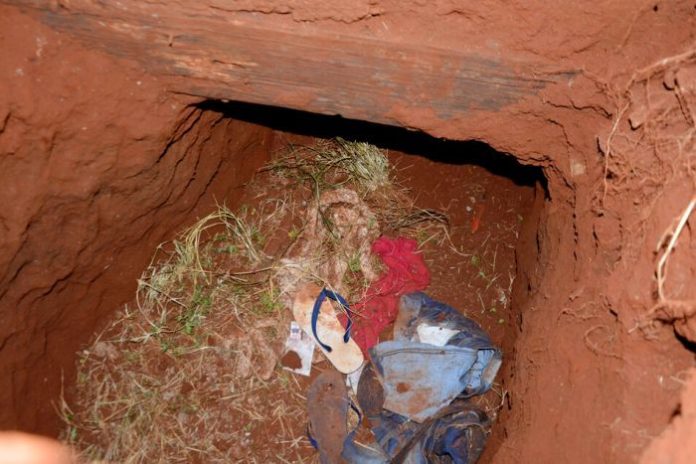 Clothes remain in a tunnel entrance where at least 75 inmates escaped on Sunday at Pedro Juan Caballero city jail in Paraguay. AP/MARCIANO CANDIA