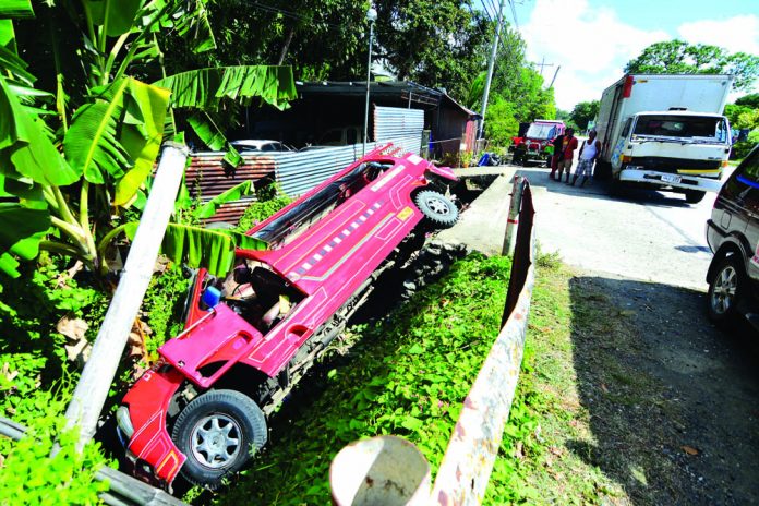 This passenger jeepney plying Igrabaras-Iloilo City route plunges into a canal after getting hit by a truck in Barangay Nanga, Guimbal, Iloilo on Jan. 6. IAN PAUL CORDERO/PN