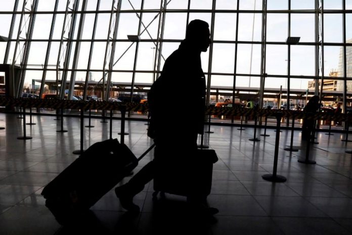 Travelers arrive at John F. Kennedy international airport in New York City, United States on Feb. 4, 2017. REUTERS/BRENDAN MCDERMID