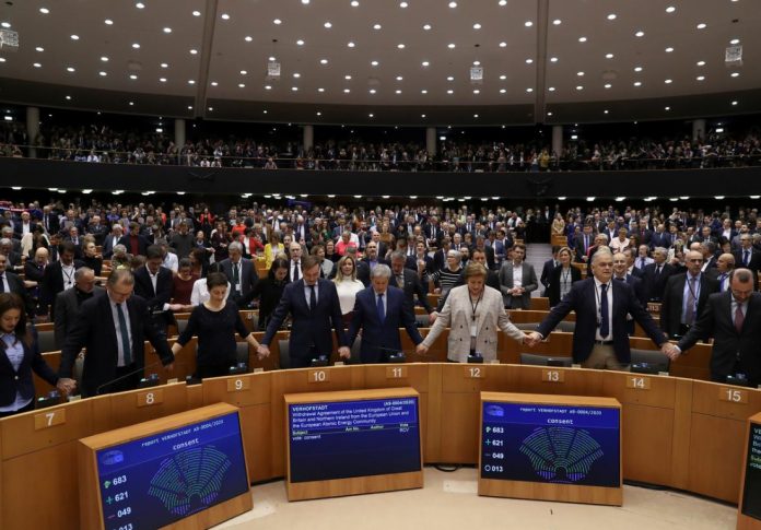 Members of the European Parliament react after voting on the Brexit deal during a plenary session in Brussels, Belgium on Jan. 29. REUTERS/YVES HERMAN/POOL