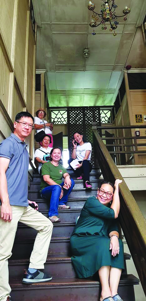 Tour guides in Negros explore the La Purissima Building