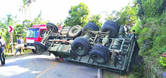 A Philippine Army truck turns turtle in Barangay San Juan, Barotac Viejo, Iloilo yesterday injuring at least 10 persons, including three soldiers and minors. CONTRIBUTED PHOTO