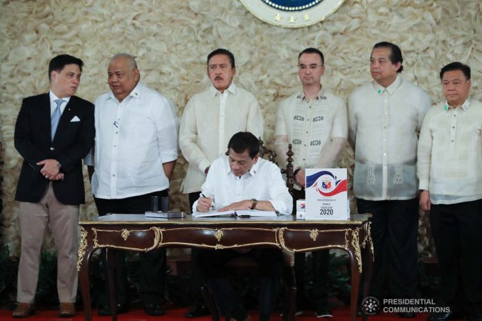 President Rodrigo Duterte signs the P4.1-trillion national budget on Jan. 6, 2020. PCOO