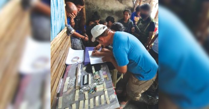 Antidrug operatives inspect these sachets of suspected in a sting operation in Barangay 5, San Carlos City, Negros Occidental. The Negros Occidental Police Provincial Office sized a total of P2.798 million worth of suspected shabu in the past week. PDEA REGION 6