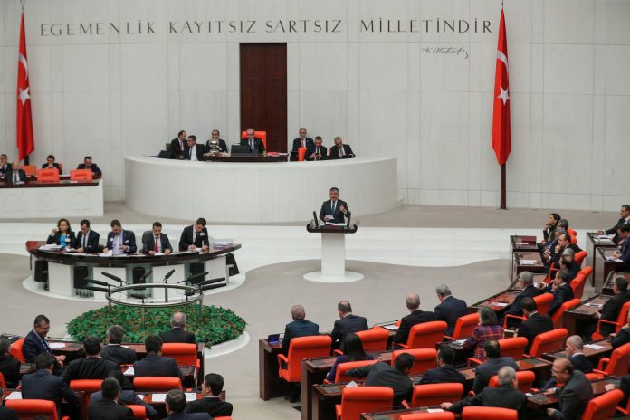 Ismet Yilmaz, head of the parliament’s national defense committee from the ruling AK Party, addresses lawmakers at the Turkish Parliament in Ankara, Turkey on Jan. 2. REUTERS/STRINGER NO RESALES. NO ARCHIVES