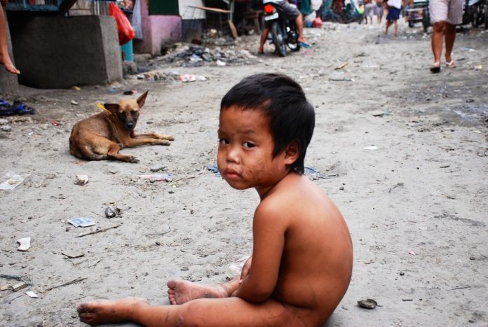 A child sits on the street. To promote a healthy community, Deputy Speaker Loren Legarda urged the local government units in the province of Antique to implement Republic Act 9003, or the Ecological Solid Waste Management Act. SARAH JONES/VICE.COM