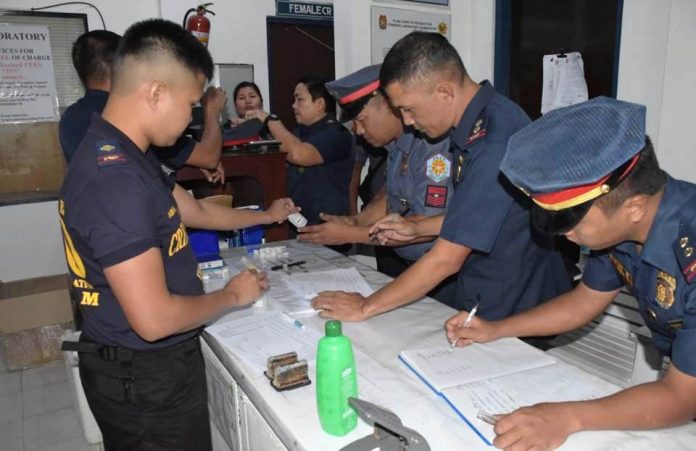 Policemen queue for drug testing at the crime laboratory of the Police Regional Office 6 in Camp Delgado, Iloilo City. Fifteen Police Commissioned Officers and 65 Police Non-Commissioned Officers were randomly picked to undergo drug testing on Feb. 3, 2020. The unannounced check wanted to ensure that no policeman engaged in illegal drug use. Results would be released soon. PHOTO BY PSSG DEPEDRO, PIO, PRO-6