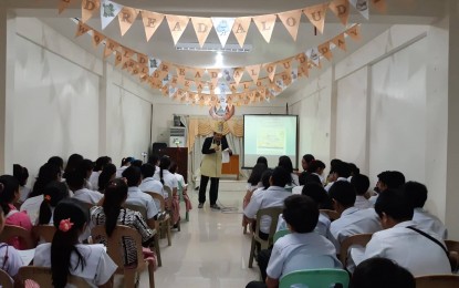 Errol Santillan, Sangguniang Panlalawigan member of Antique, leads the World Read Aloud Day on Feb. 5. The activity aims to encourage students to make reading a habit. ANNABEL CONSUELO PETINGLAY/PNA